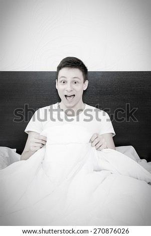 Happy man smiling after masturbation in bed at home , Male reaction to good potency and healthy erection
