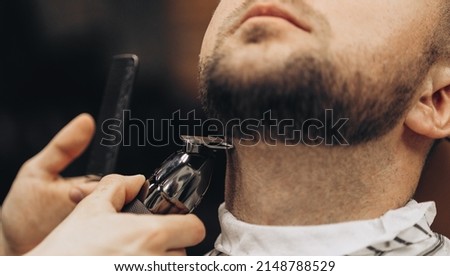 Similar – Image, Stock Photo Crop barber doing haircut for man