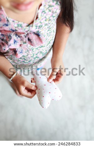 Asian young girl with  valentines heart in hands,background for valentine.  Shallow depth of field composition