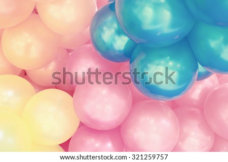 Colorful balloons background,with a pastel colored and soft focus.