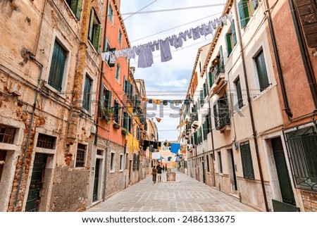 Similar – Foto Bild Historische Gebäude und Wäscheleinen in der Altstadt von Venedig in Italien