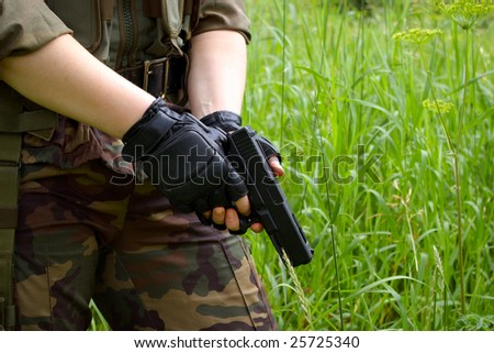 gun in hands of a soldier