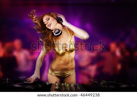 Beautiful DJ girl on decks on the party,