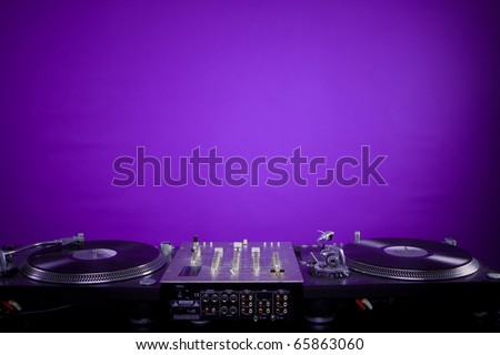 dj equipment on violet background