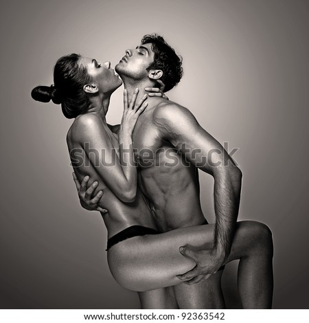 Passionate Naked Couple In Suggestive Pose, monochrome studio portrait in square format