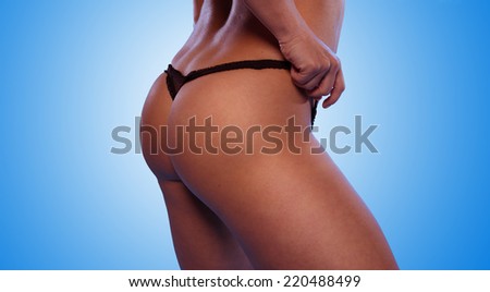 Sexy Woman Ass with Black T-Back Underwear Isolated on Gradient Sky Blue Background.