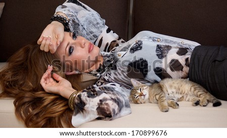 beautiful red haired woman with little kitty