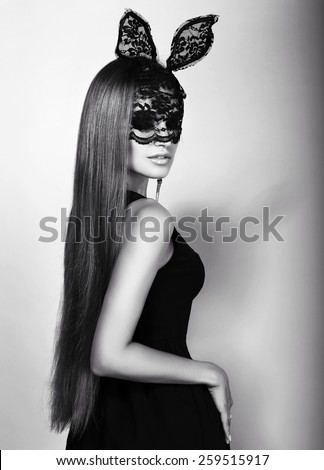 black and white fashion photo of beautiful sexy Easter bunny girl with luxurious straight hair