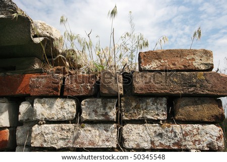 Old brick wall against the blue sky
