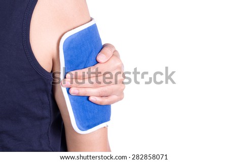 a woman applying cold pack on her arm