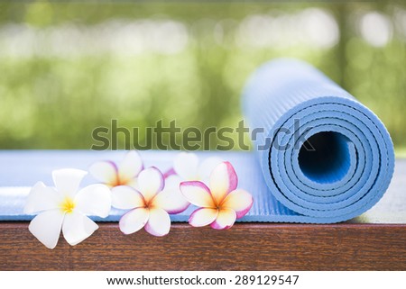 blue yoga mat and a flowers