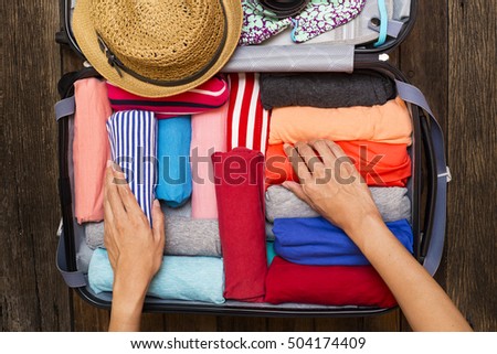 Similar – Image, Stock Photo Close-up of woman packing wooden box with freshly picked vegetebles on field