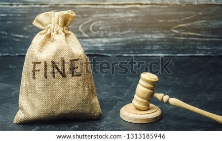 Money bag with the word Fine and the judge's hammer. Penalty as a punishment for a crime and offense. Financial punishment. Violations of traffic laws. Fraud. Fines can also be used as a form of tax Stock foto © 