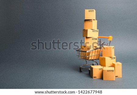 Shopping cart supermarket with boxes. Sales of products. The concept commerce, online shopping. Purchasing power, delivery order. E-commerce, sales and sale of goods through online trading platforms. 商業照片 © 