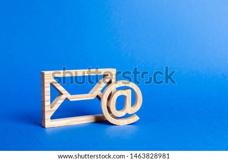 Envelope and email symbol on a blue background. Concept email address. Internet technologies and contacts for communication. Communication over the network, business and correspondence.