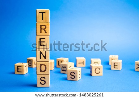 Wooden blocks with the word Trends. Popular and relevant topics. New ideological trends of fashion. Recent and latest trend. Evaluation methods. Foto d'archivio © 