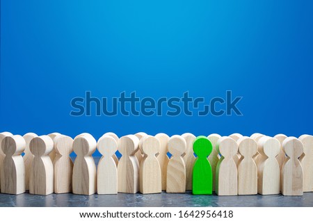 A green man stands out from the crowd. Talented and skillful suitable candidate. Initiative and active person, leader. Employee of the month. Best choice of all. Search professionals specialists Photo stock © 