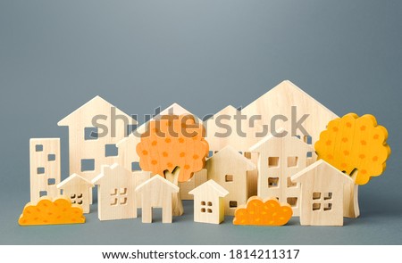 City of figures houses and autumn yellow trees. Real estate concept. Urbanism and infrastructure. Realtor services. Affordable housing. Changing seasons. Travel and tourism in the cities of the world. Foto stock © 