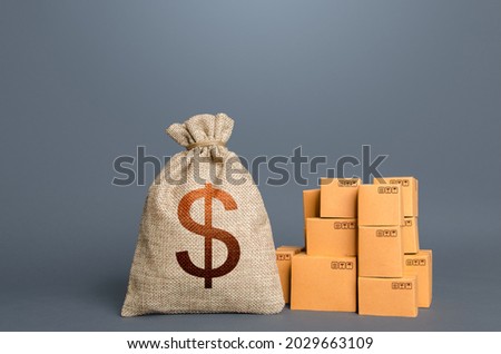 Boxes and dollar money bag. The concept of trade in goods and production. GDP and economy. Import export. Warehousing logistics. Business industry. Delivering. Profit from trading. Financial success. Photo stock © 