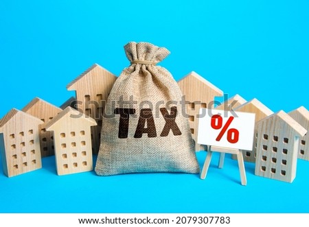 Houses and a bag of taxes. Real estate tax. Taxation on purchase or sale of a home. Maintenance of housing and land. Tax interest. Fees and duties. Rental business. Return on investment. Taxes relief