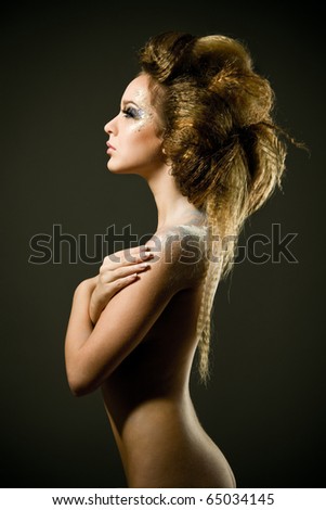 Fashion studio photo of beautiful nude woman with long hair