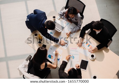 Marketing Analysis Accounting Team Teamwork Business Meeting Concept. Top view in office while people having a meeting