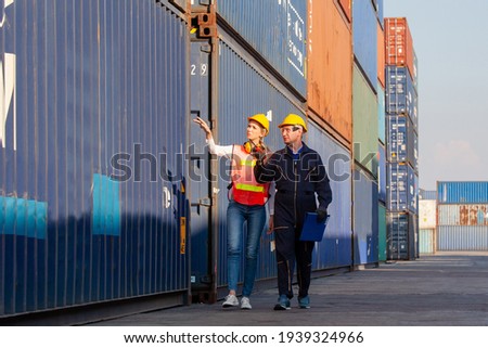working engineer in the construction container yard.  worker and supervisor checking containers data. Container Shipping Logistics Engineering concept Zdjęcia stock © 