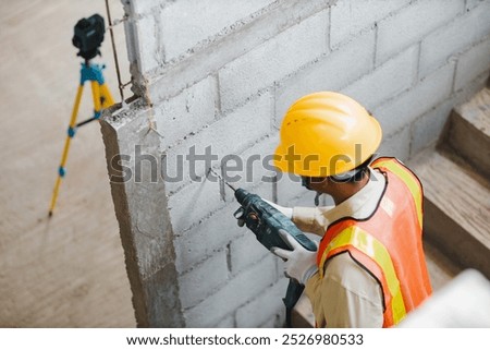 Similar – Image, Stock Photo Man worker drilling wall with hammer drill, top view