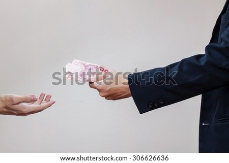 Man\'s hands and money in his palms
