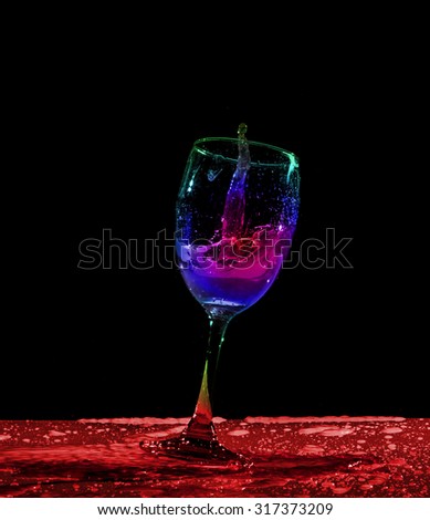 Red wine splash on black background