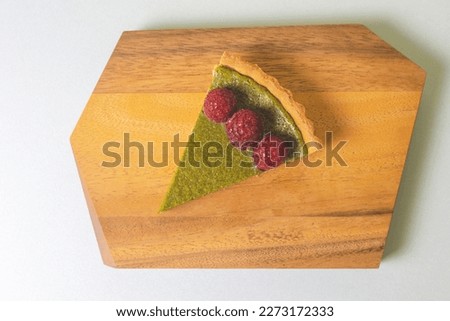 Similar – Image, Stock Photo Matcha cheesecake slice tart. Green cake slices equally
