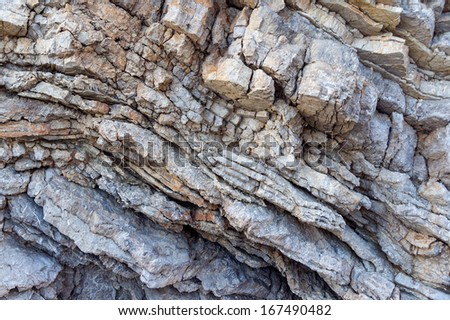 Texture of a sheer cliff on the shore of the sea