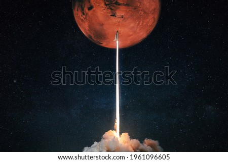 Rocket with blast and smoke takes off to the red planet mars mars, concept. Spacecraft lift off to explore other planets. Rocket launch