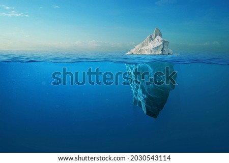 Iceberg With Above And Underwater View Taken In Greenland. Iceberg - Hidden Danger And Global Warming Concept. Iceberg illusion creative idea