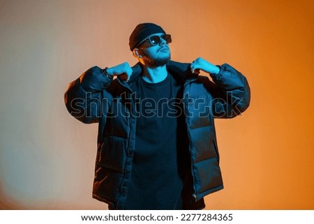 Similar – Image, Stock Photo Young man in neon red illumination