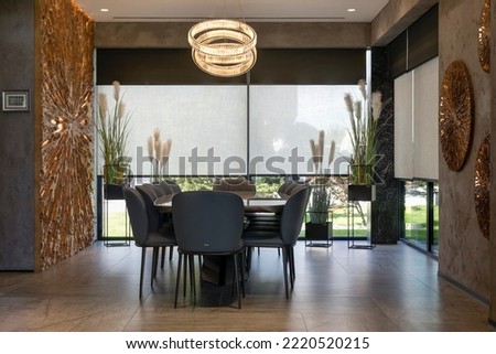 Roller blinds on the windows in the interior. Automatic double solar and blackout shades large size. Modern interior with wood decor panels on the wall. Electric sunscreen curtains for home.  Foto stock © 