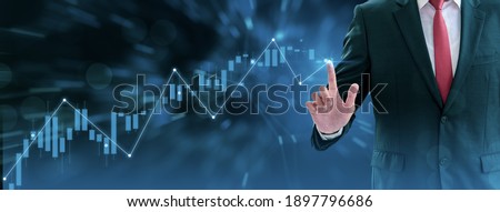 Businessman using finger touch symbol stock graph and chart background,concept growth and development business investment,Stock market and strategy making market plan and stock market fluctuations 