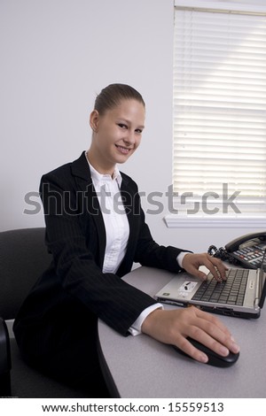 woman executive with brown pulled back hair