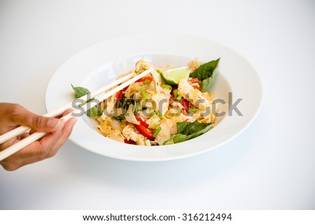 Thai dish of chicken Pad Kee Mao with Bell Pepper and Thai Basil