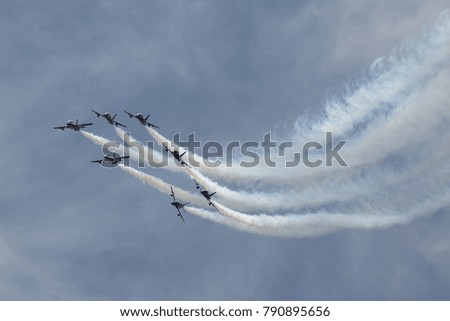 Group of airplanes make a figure in air during airshow aerobatic  Stok fotoğraf © 