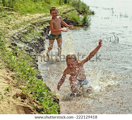 Children play in the water