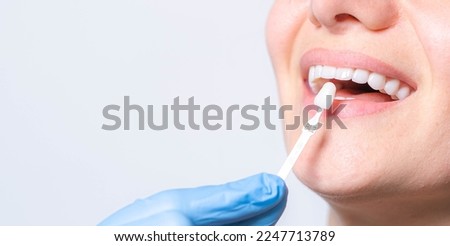 Banner tooth whitening, perfect white teeth close up with shade guide bleach color, female veneer smile, dental care and stomatology, dentistry, copyspace. Stockfoto © 