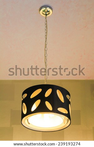 Modern hanging lamp on the ceiling.