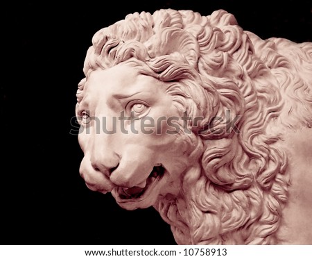 White lion head sculpture isolated on black