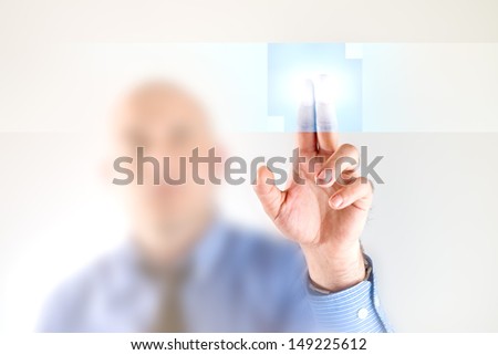Businessman pressing touch screen button. Modern business technology solutions.