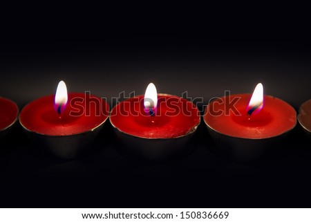 Aromatic tea light candles burning on the table.