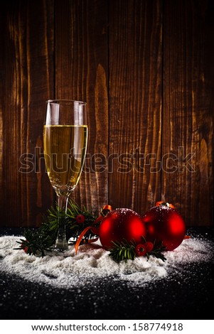 Happy New Year card. White wine and christmas balls. New Year\'s Eve decoration.