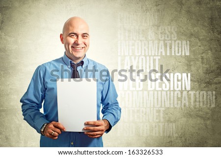 Web designer holding blank A4 paper as copy space internet concept