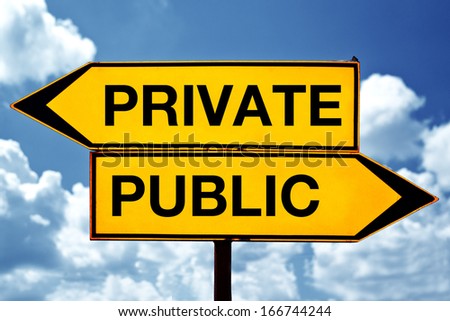 Private versus public, opposite signs. Two opposite signs against blue sky background.