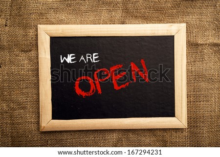 We are open note on black message board